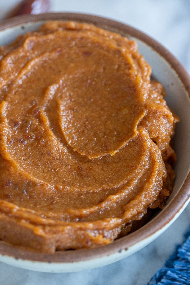 close up of date paste in a bowl to be used as a natural sweetener