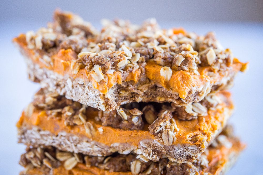 close up of a sweet potato pie bar with a bite taken out of it