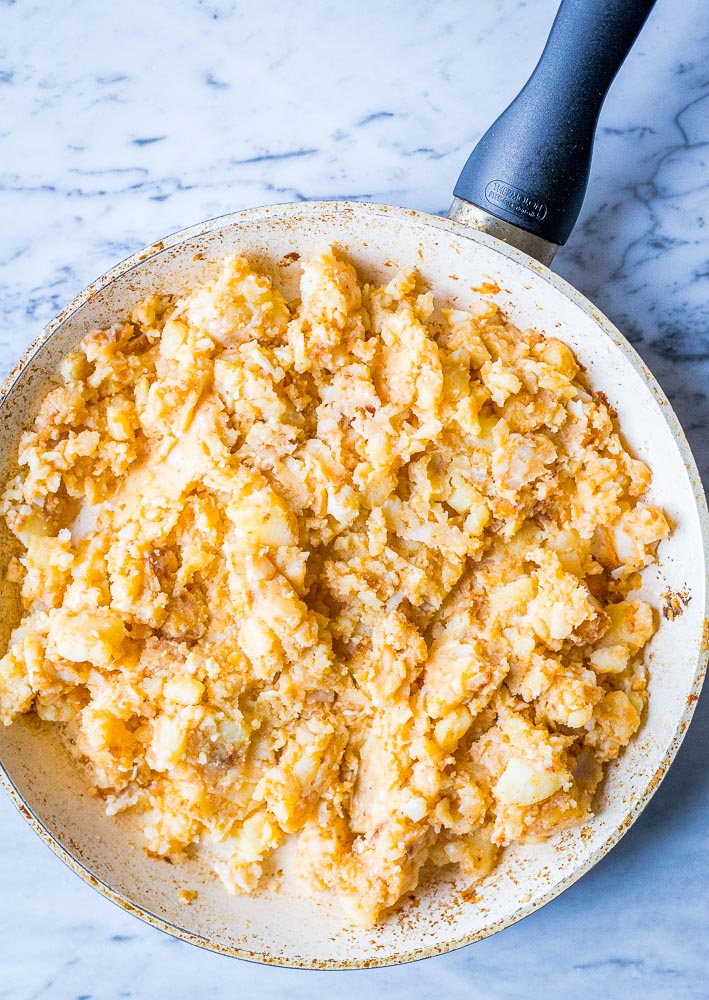Cheesy potato mixture in a pan