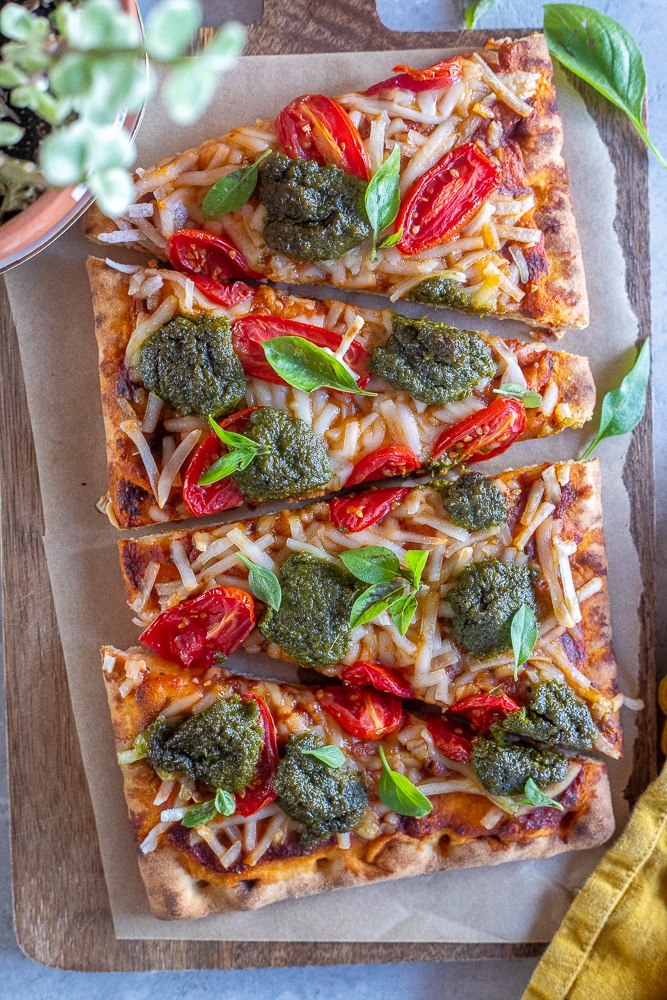 Vegan Tomato Pesto Pizza cooked and sliced