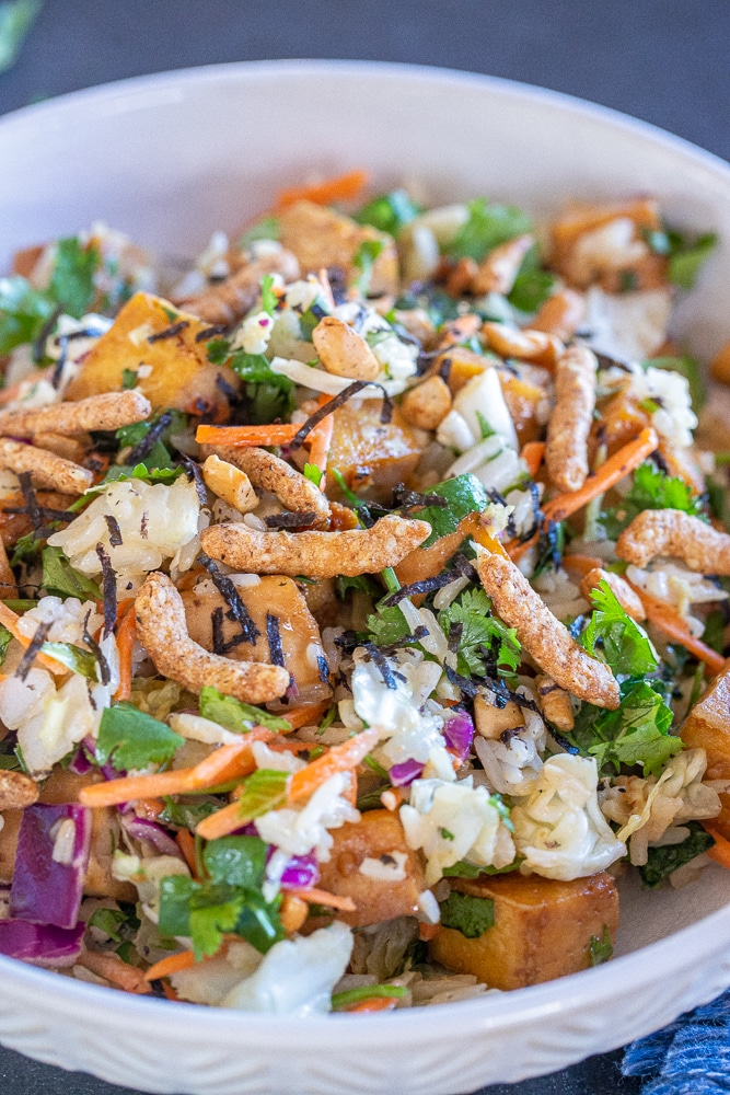 close up photo of crunchy sesame salad with rice and tofu