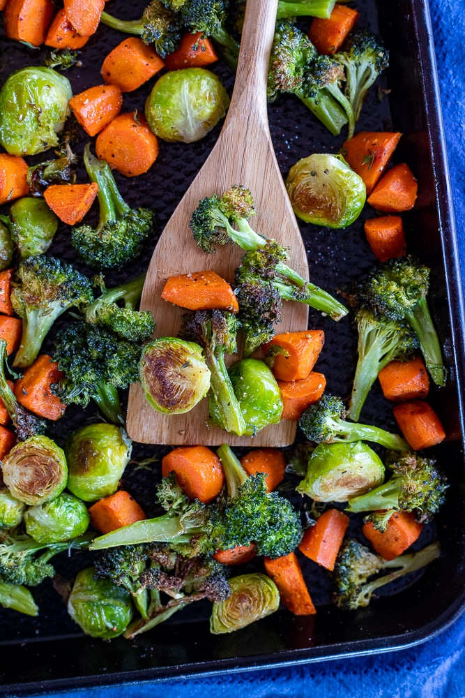 perfect roasted vegetables on a sheet pan with a spatula
