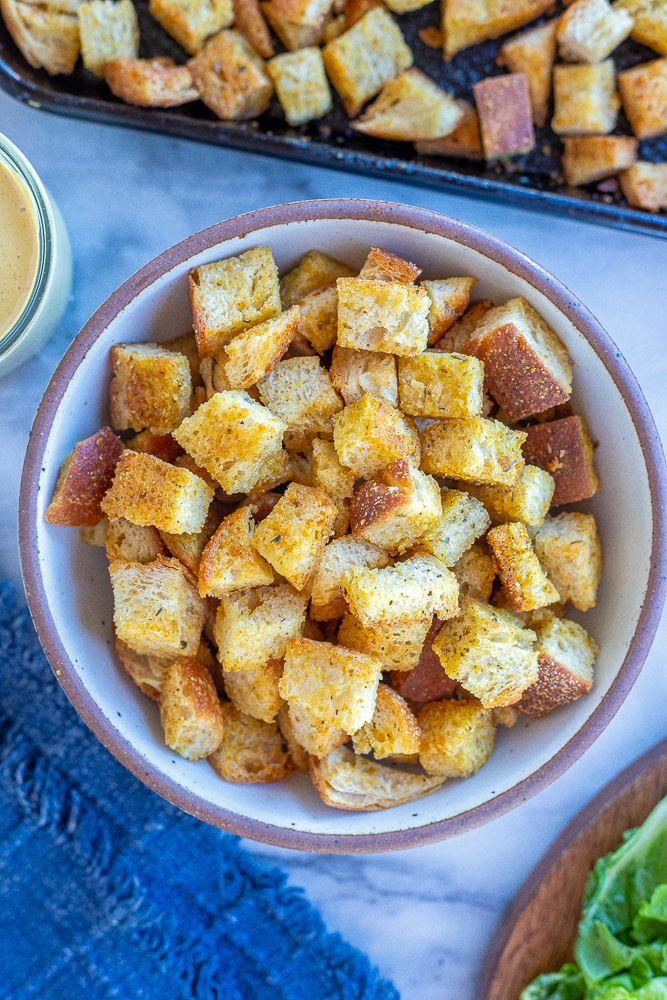 a bowl of homemade croutons with garlic and herbs