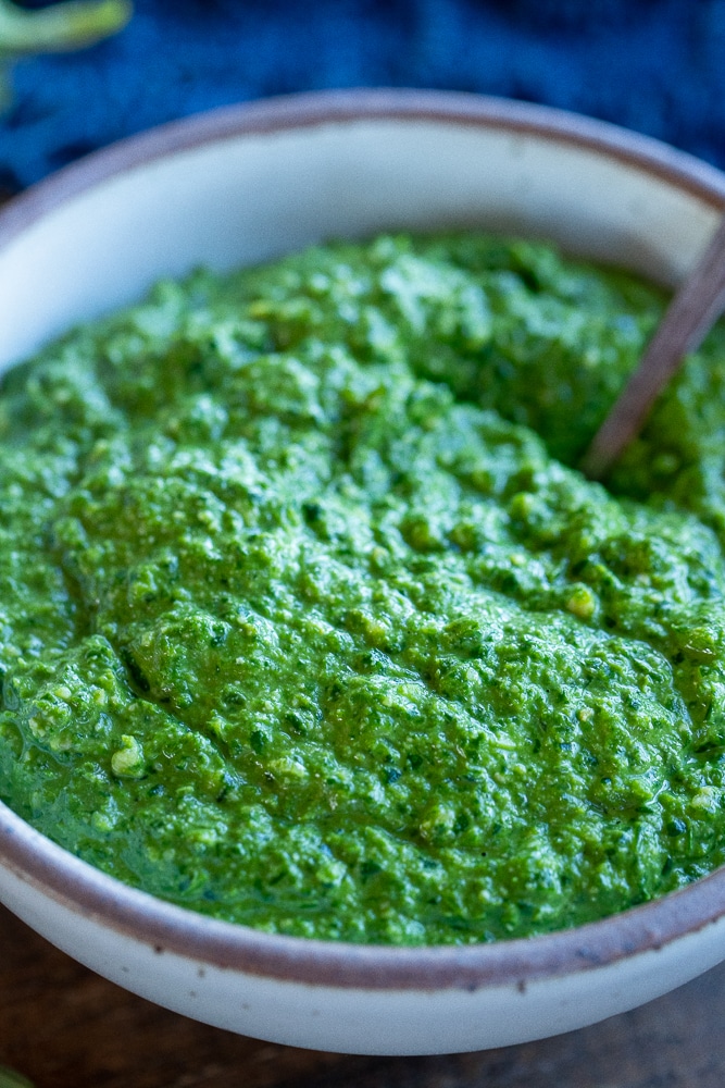 close up of a bowl of vegan pesto