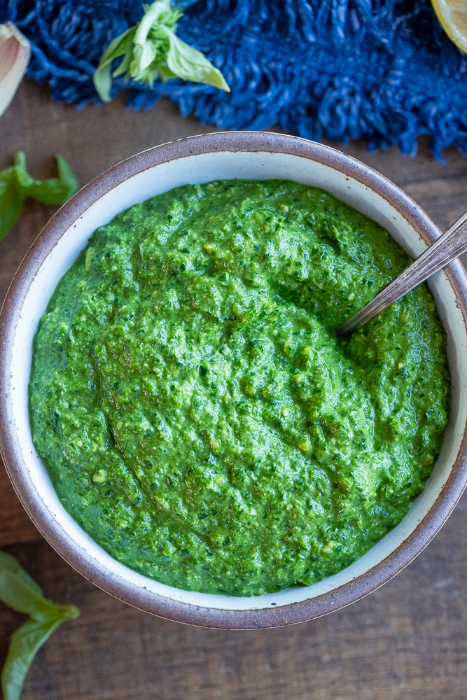 flat lay photo of vegan pesto sauce in a bowl