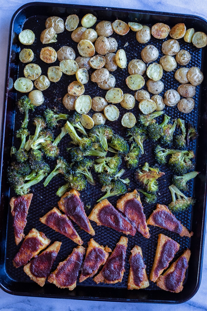 sheet pan bbq tofu with potatoes and broccoli out of the oven