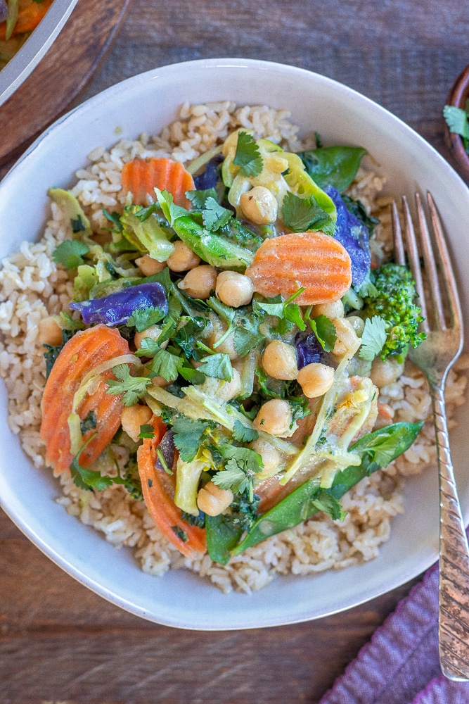 close up of a big bowl of Thai green curry with chickpeas