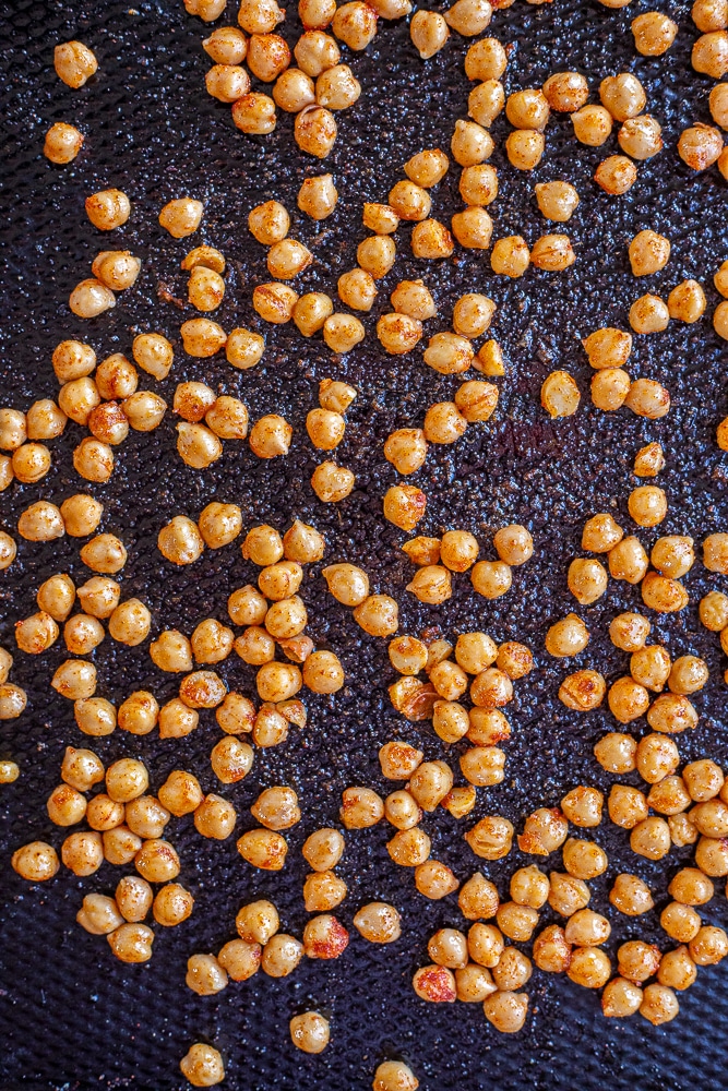 seasoned chickpeas on a sheet pan 