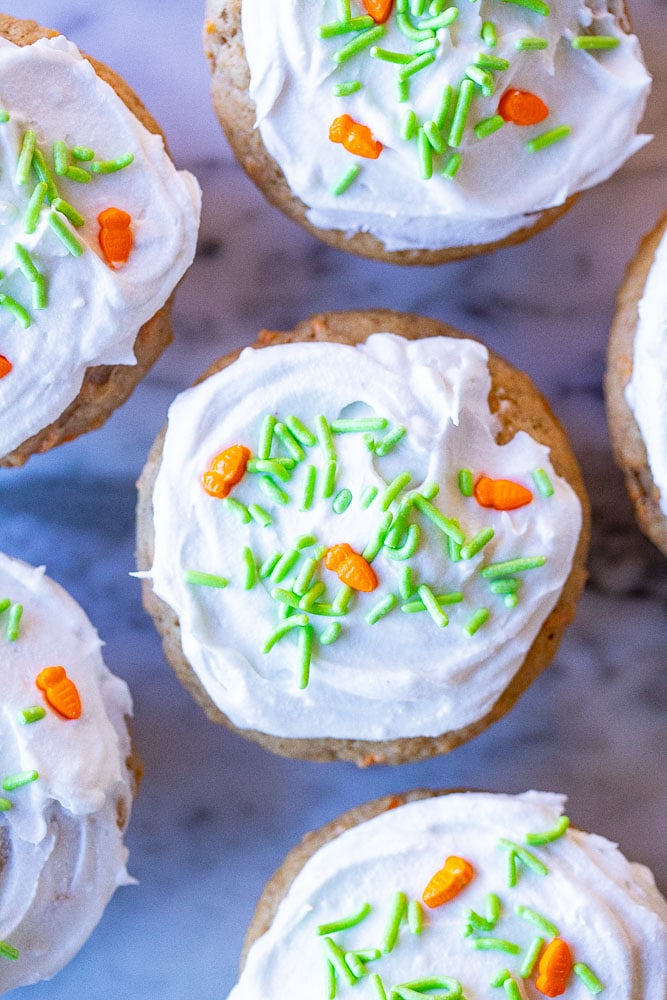 carrot cake muffins with frosting and sprinkles