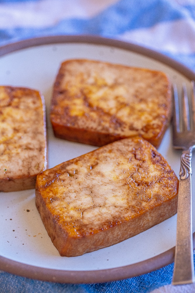 close up of a slice of easy fried tofu on a plate