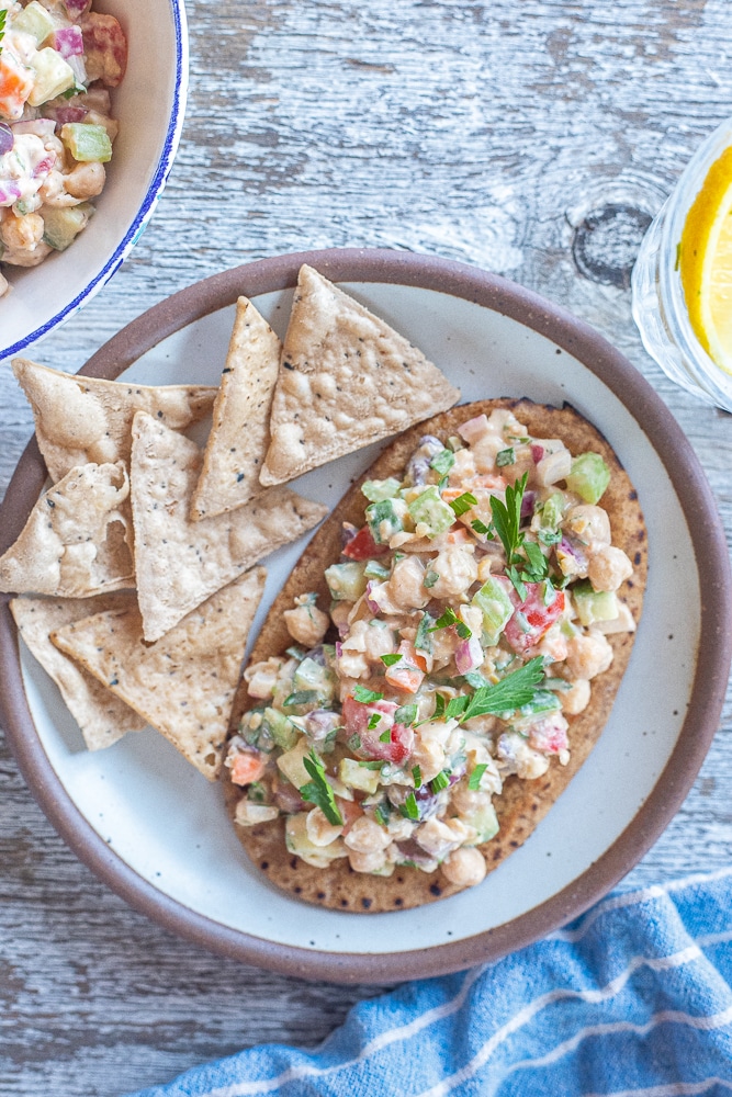 chickpea salad recipe on a pita with some chips
