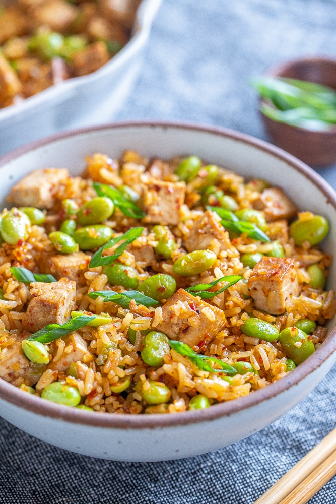 close up of a bowl of spicy edamame stir fry with tofu