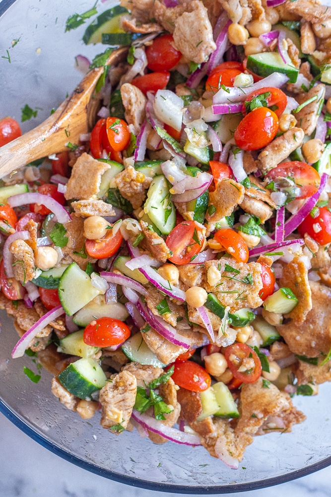 crispy pita bread salad mixed together in a bowl