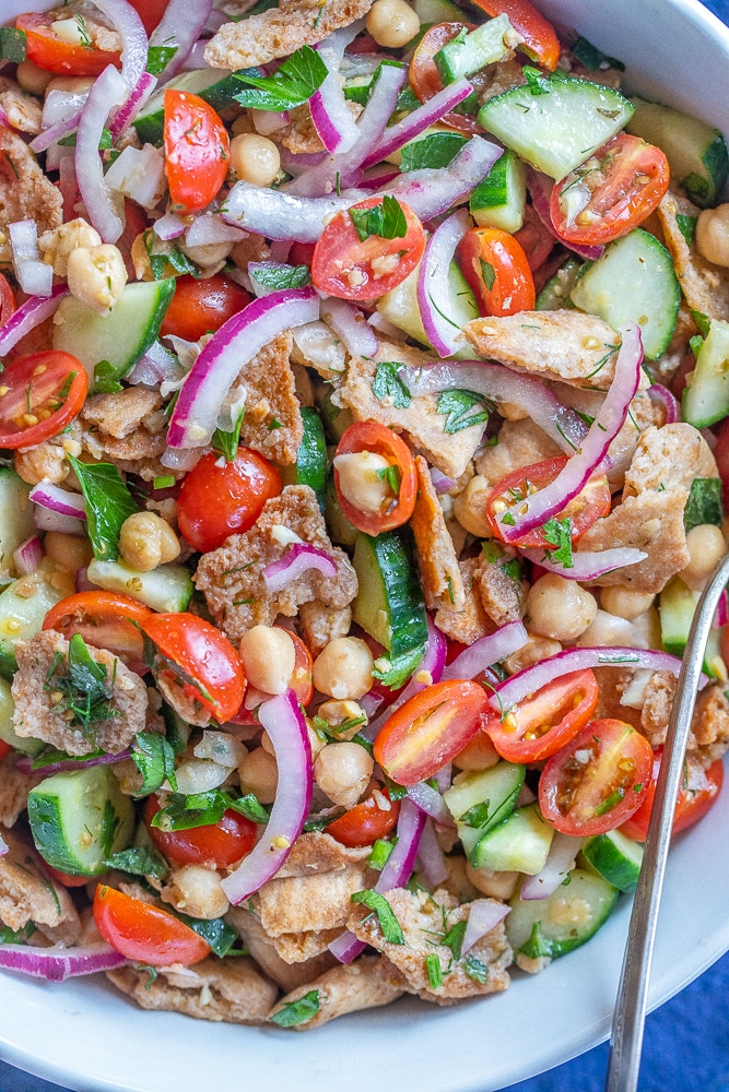 close up of crispy pita bread salad in a bowl