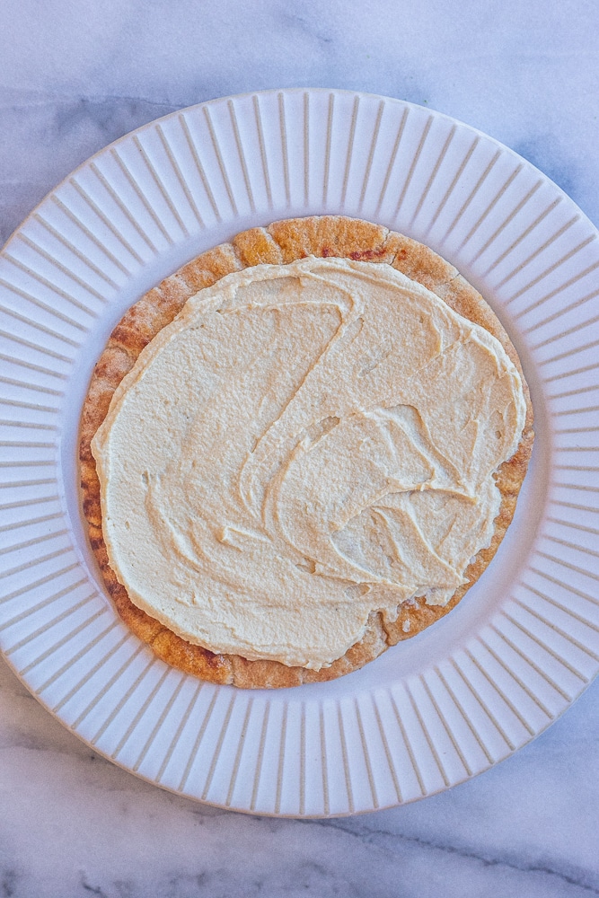 pita bread with hummus on a plate