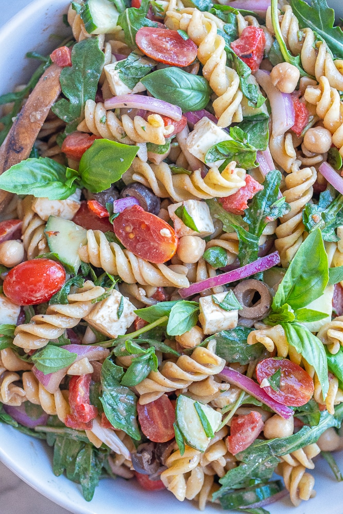 close up of creamy balsamic pasta salad in a bowl