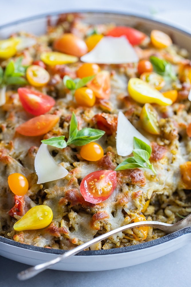 baked pesto orzo in a skillet