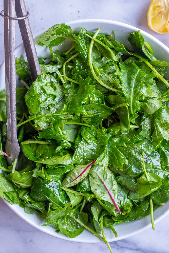 5 minute dinner salad in a bowl with some tongs