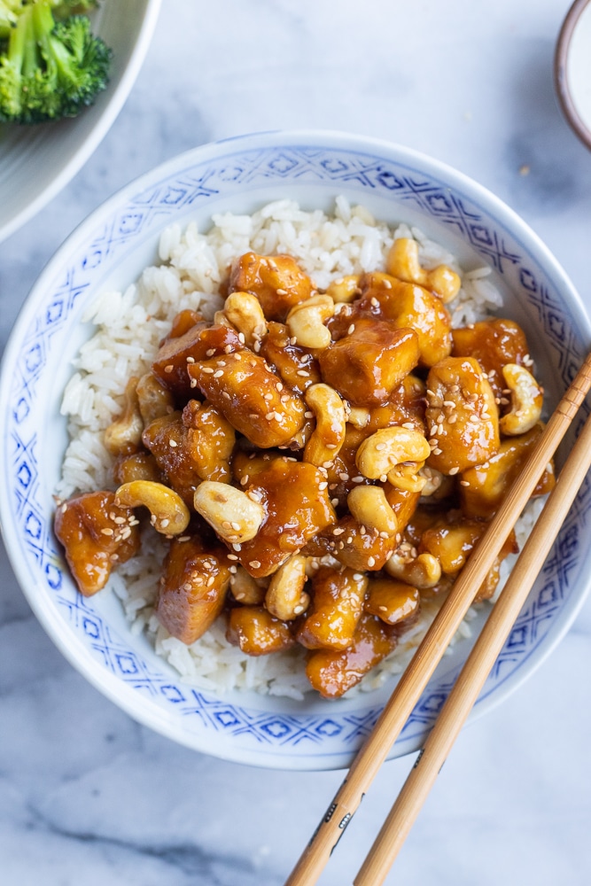 bowl of sticky ginger cashew tofu with rice and vegetables