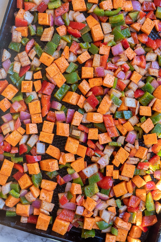 sweet potato hash on a sheet pan before it has been roasted