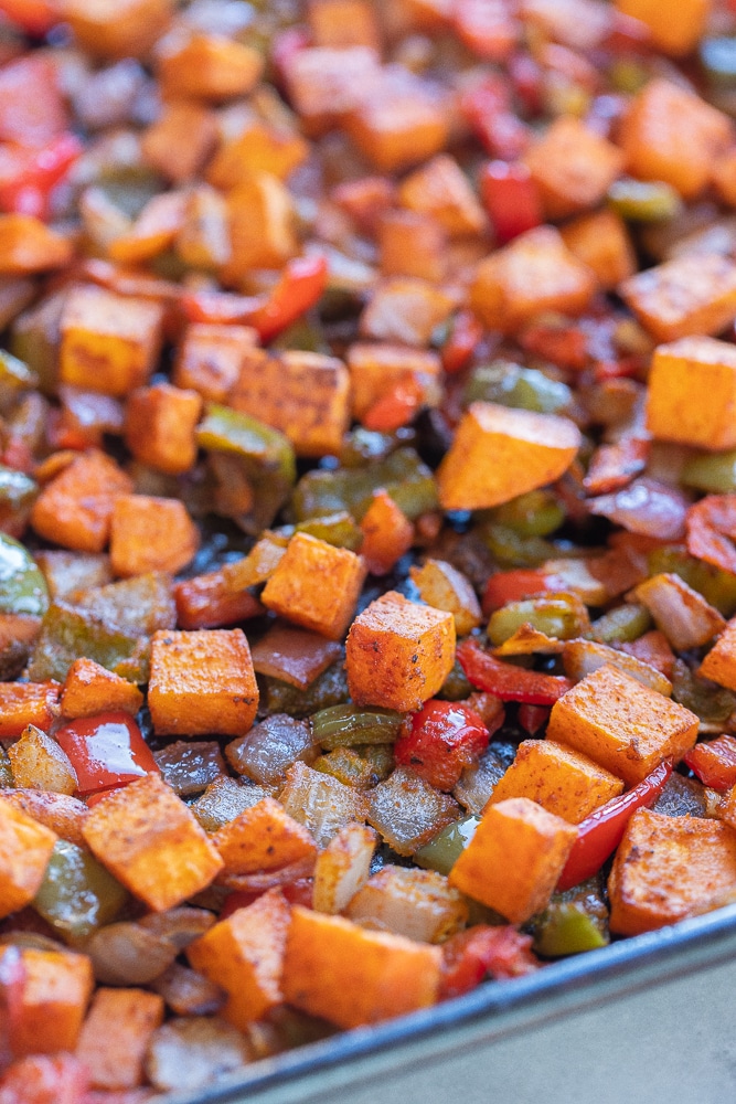 close up of sweet potato hash on a sheet pan