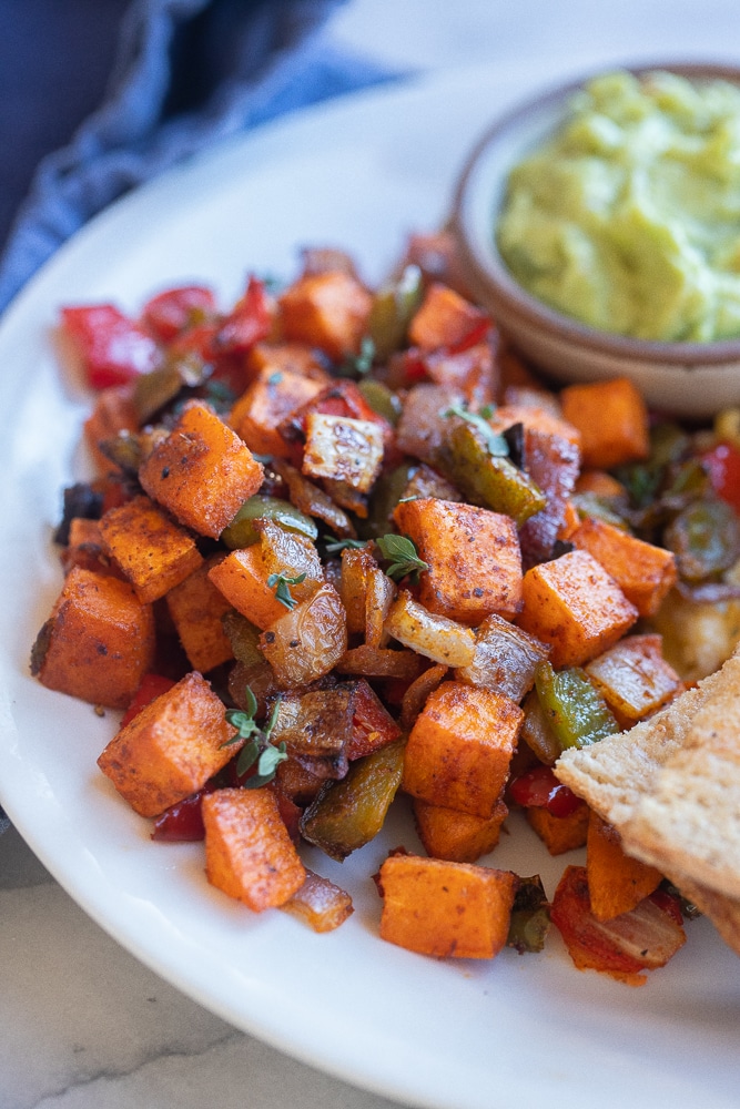 close up of roasted sweet potato hash on a plate