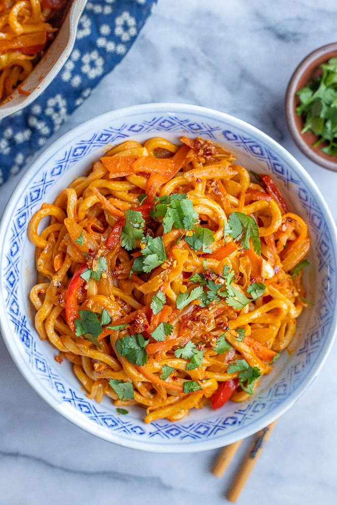 bowl of Coconut Red Thai Curry Noodles with vegetables