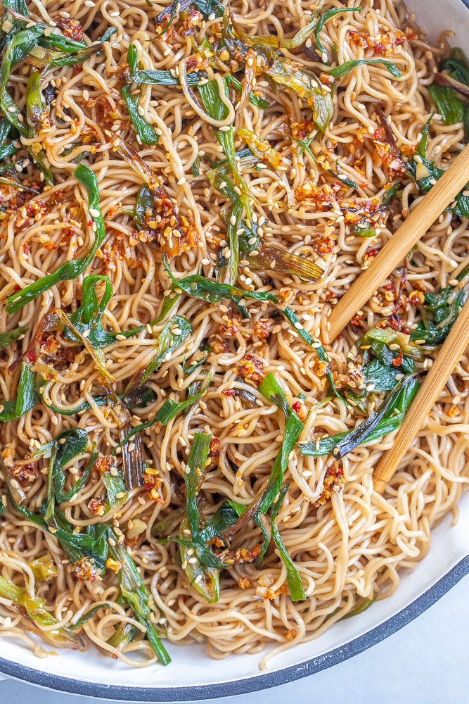 pan of scallion soy noodles with chopsticks