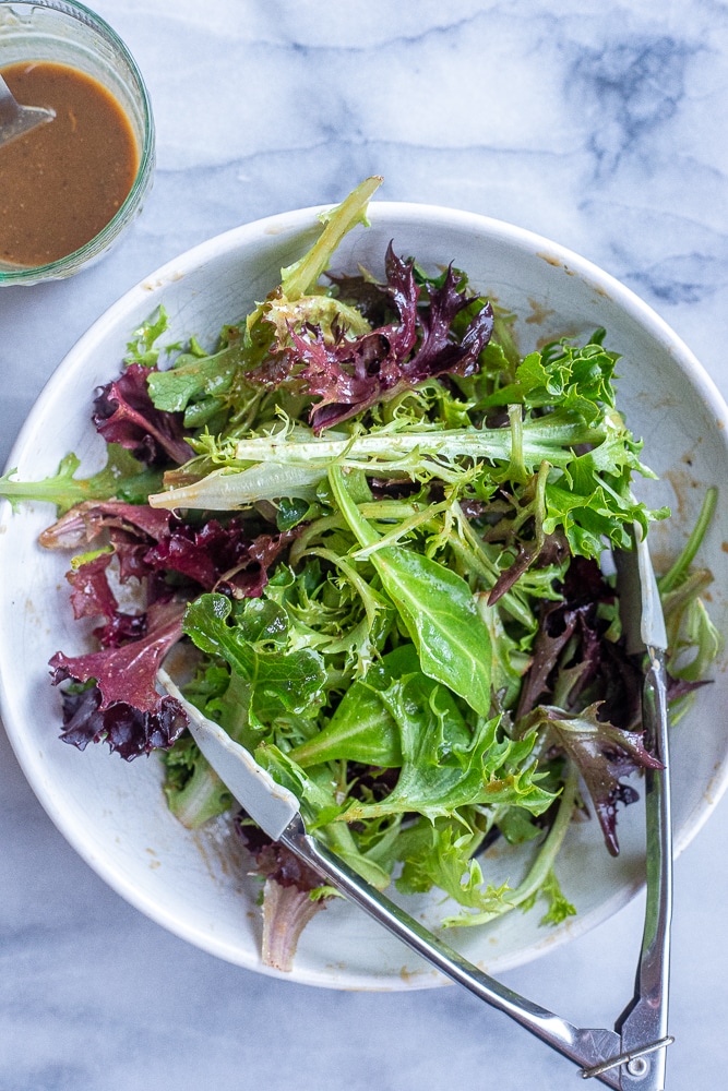bowl of mixed greens with balsamic dressing