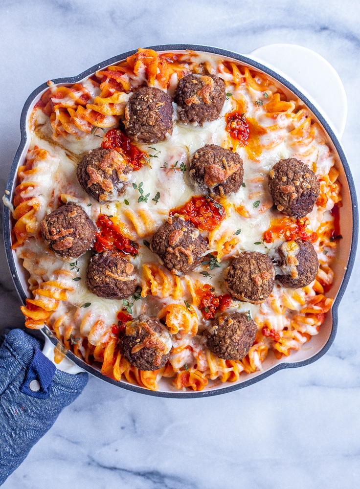 pan of spicy baked pasta with vegetarian meatballs and cheese
