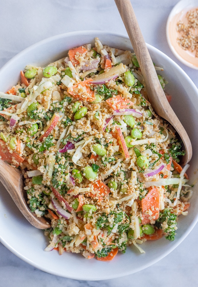 quinoa and edamame salad with tahini dressing in a serving bowl
