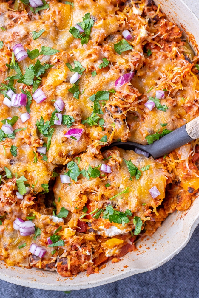 vegetarian stuffed pepper casserole with a serving spoon in it