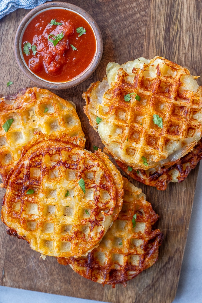cutting board with cheesy gnocchi waffles