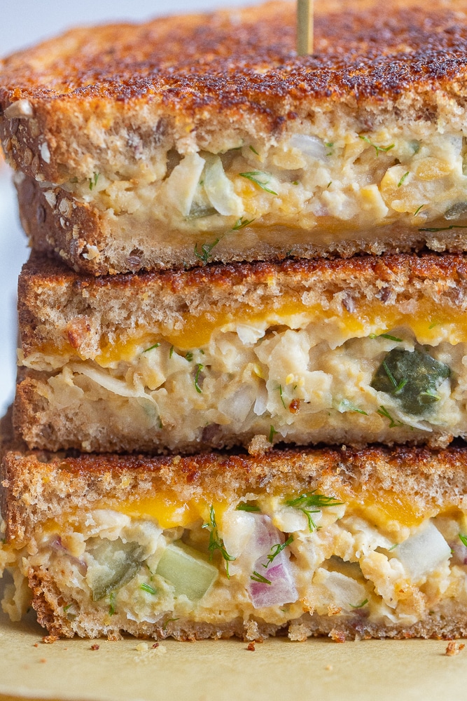 three chickpea salad melts stacked onto of each other closeup