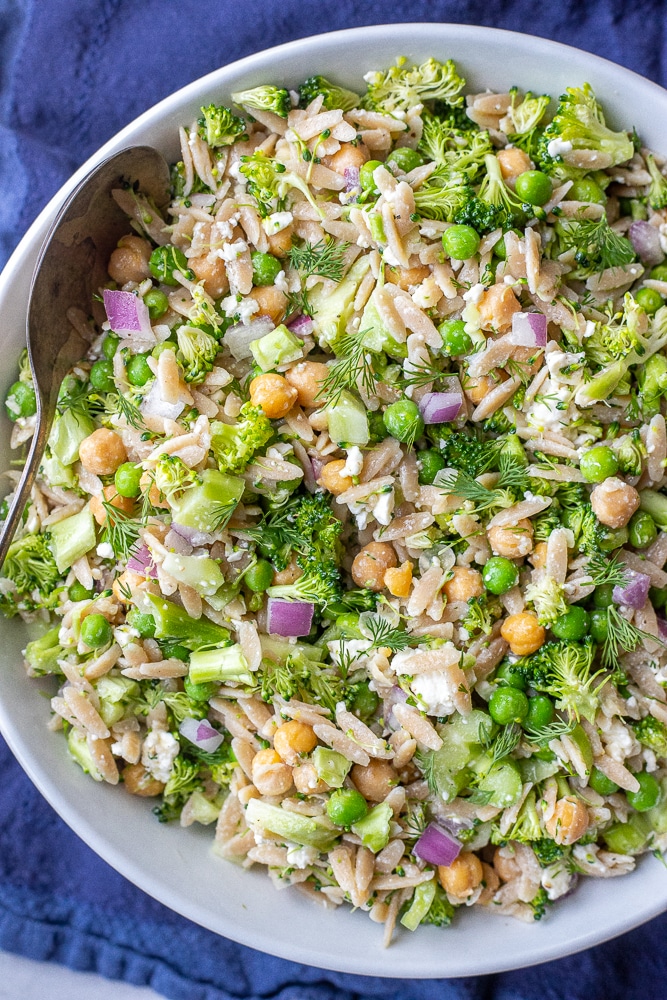 Lemon Dill Orzo Broccoli Salad in a bowl with a serving spoon
