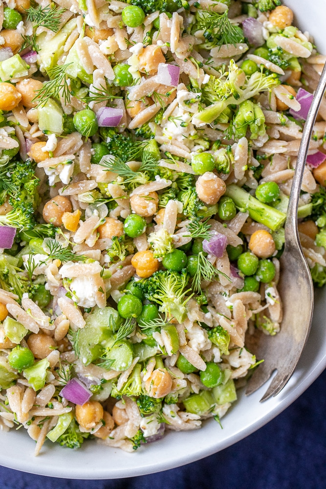 close up of orzo broccoli salad in a bowl