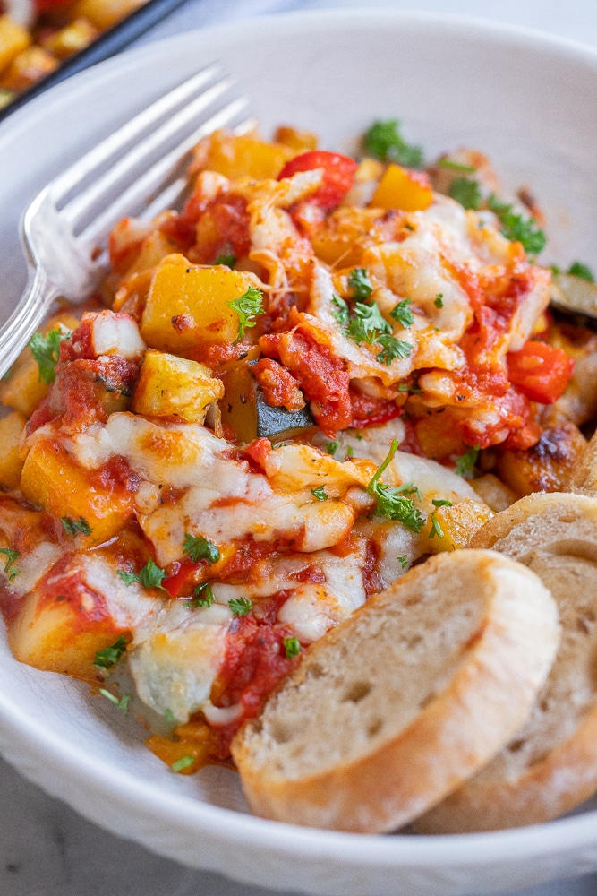 close up of polenta pizza bake in a bowl