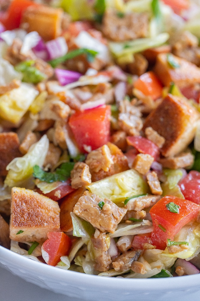 Close-up of vegan BLT panzanella in a serving bowl