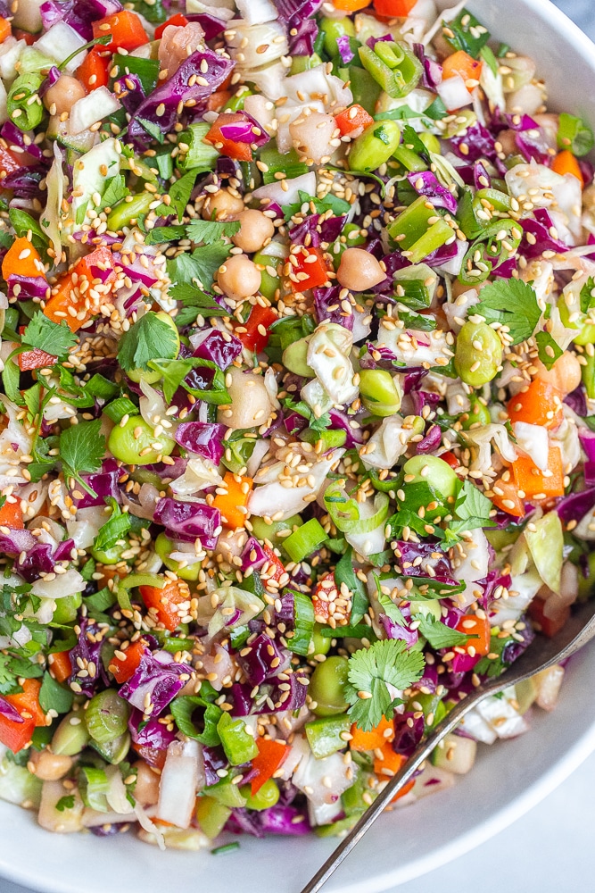 Asian Chopped Salad in a bowl with a serving spoon