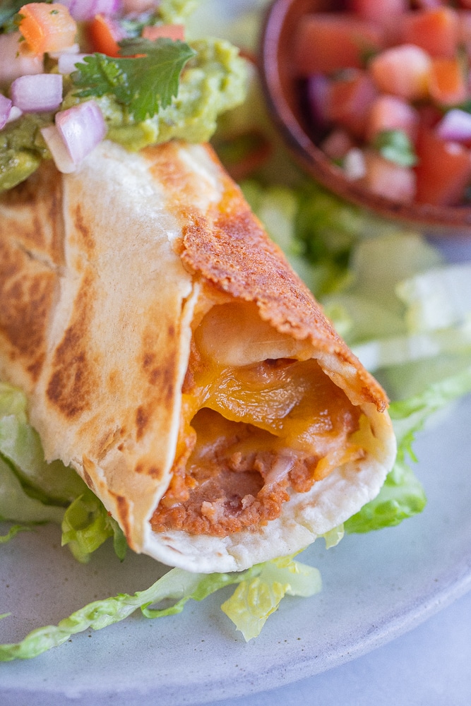 close up of a crispy baked bean burrito