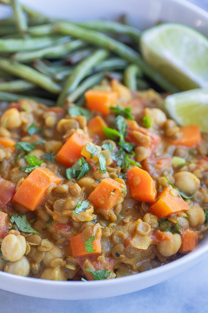 close up of lentil chickpea coconut curry in a bowl