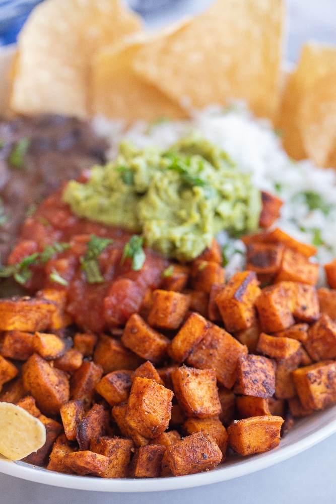 close up of the roasted sweet potato in the vegetarian burrito bowl