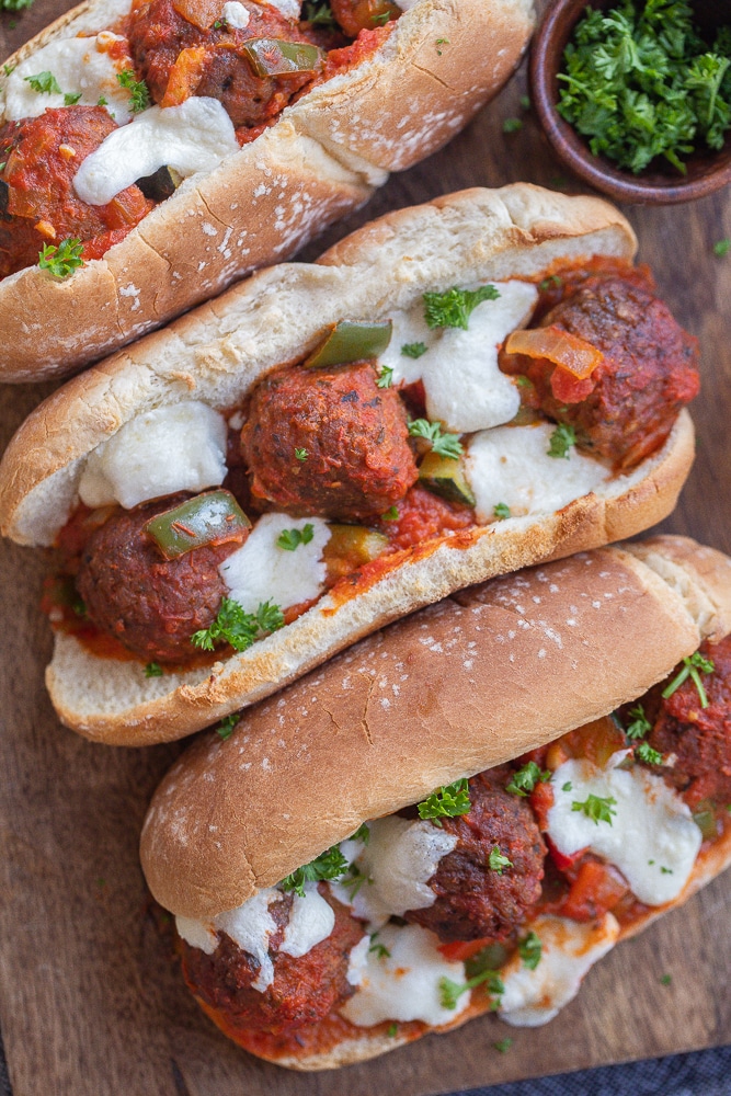 close up of a vegetarian meatball sub with melted mozzarella cheese