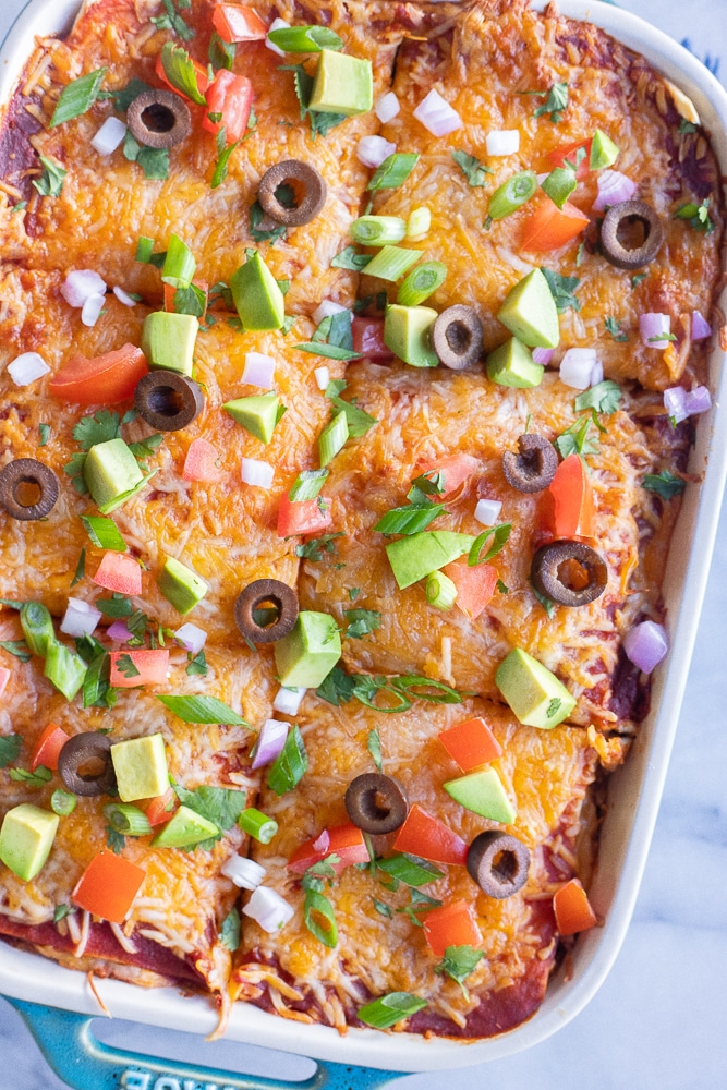 soft taco casserole in a pan with toppings