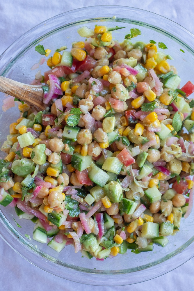 all the salad ingredients mixed together in a bowl