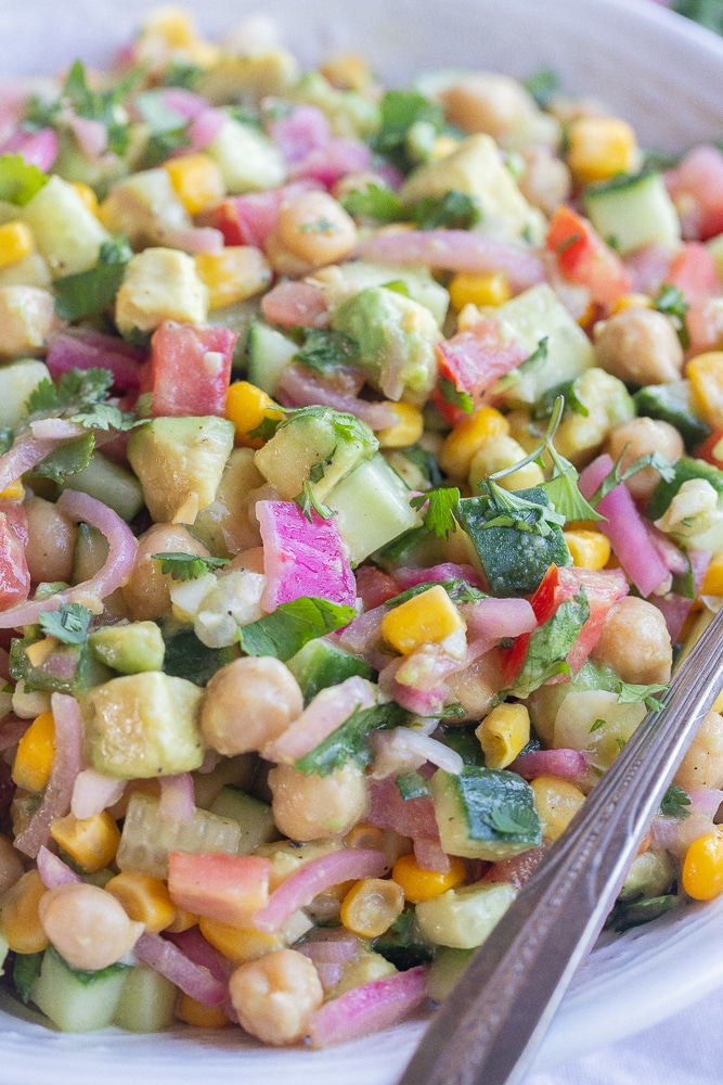 close up of summer corn salad with pickled onions