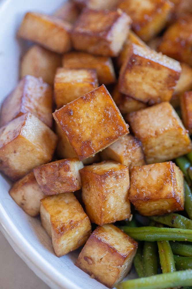 close up of easy pan fried tofu that is browned and crispy
