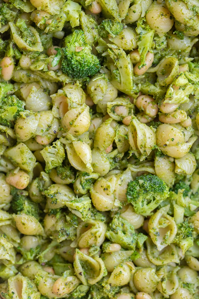 close up of vegan pesto pasta with white beans