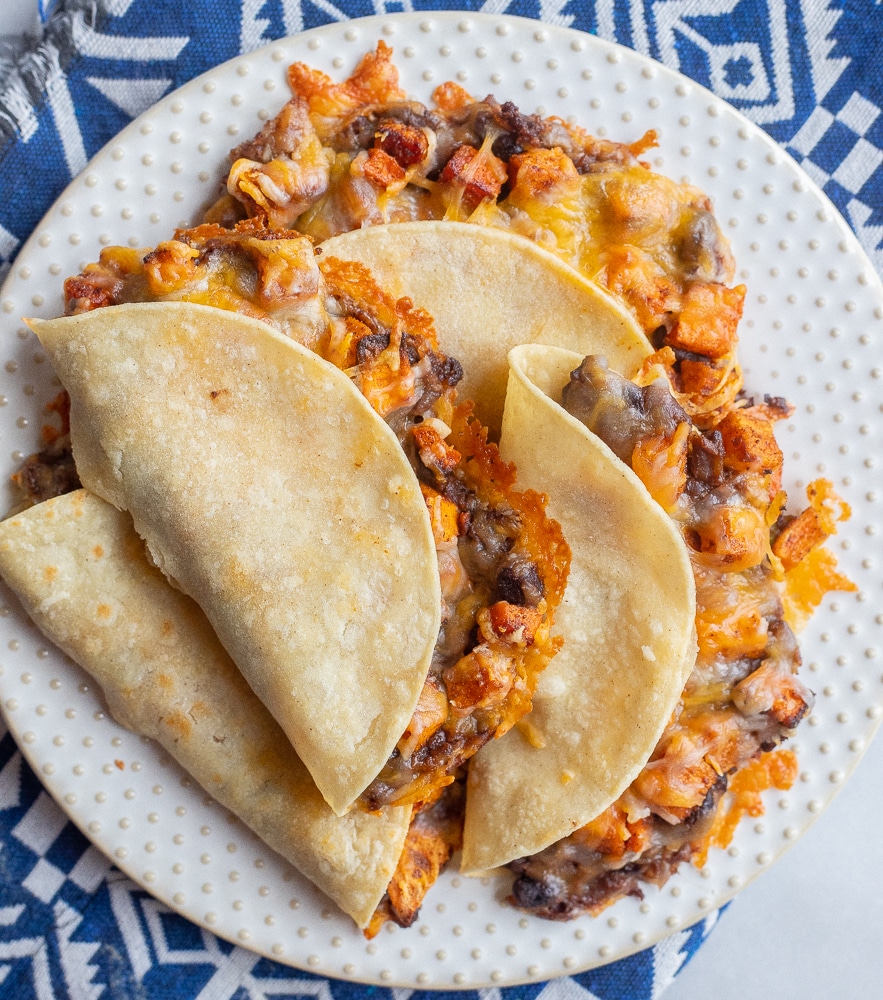 crispy baked sweet potato and black bean tacos on a plate