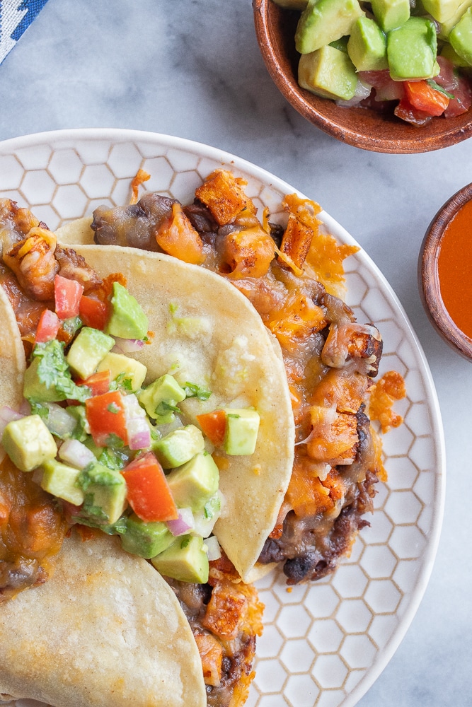Close up of a roasted sweet potato taco with black beans